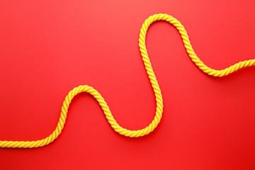 Long rope on color background