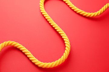 Long rope on color background