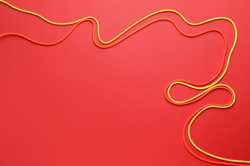 Long ropes on color background