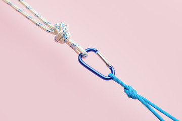 Ropes with lobster clasp on color background