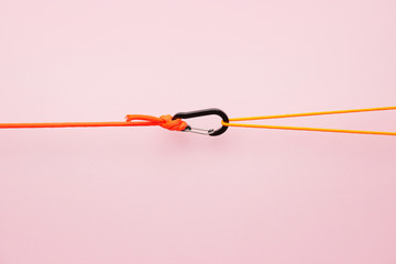 Ropes with lobster clasp on color background