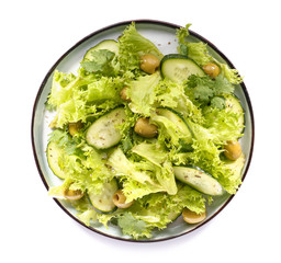 Plate with tasty cucumber salad on white background