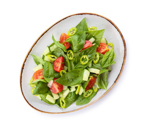 Plate with tasty cucumber salad on white background