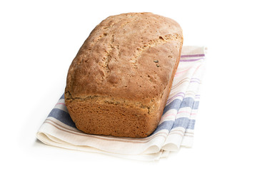 Homemade wholemeal rye bread on wooden table