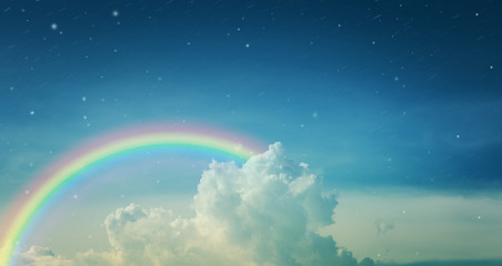 rainbow in winter blue sky