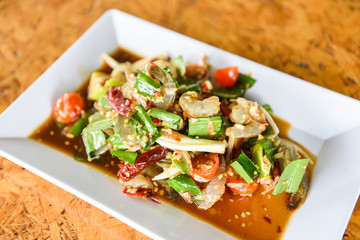 Raw Shrimp Salad - Thai Style spicy seafood sauce shrimps prawns salad on white plate