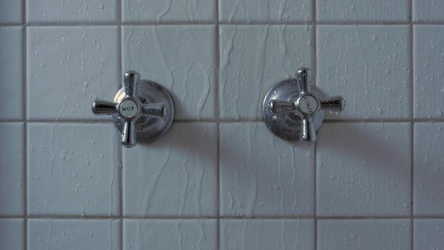 Shower Taps Hot And Cold With Water Dripping  And Shower On