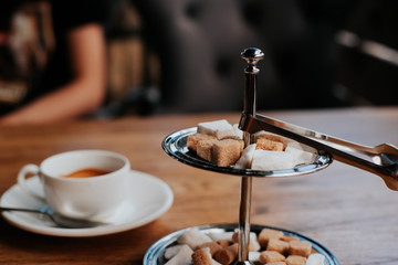 metal stand for white and dark sugar