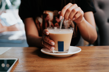 girl holding a cup of coffee