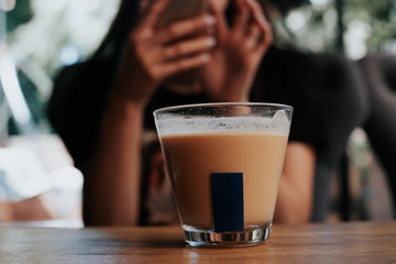 girl holding a cup of coffee