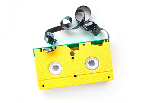 yellow videotape Isolated on white background. Creative concept in retro style, 80s. Top view, minimalism. Retro technology concept. Blank screen for text.