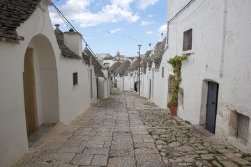 Trullo along the street at Alberobello, Apulia, Italy