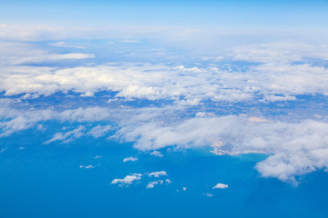 Fototapeta na wymiar Landscape with white clouds and blue sea