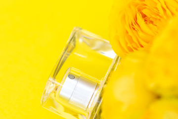 Perfume bottle with yellow rose flowers
