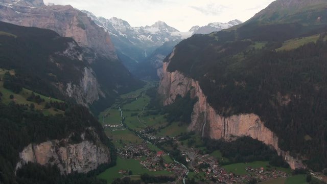 Aerial drone shot of the City of Lauterbrunnen, Switzerland on a calm evening