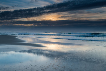 Sunrise Seascape with Clouds and Ships on the Horizon