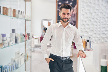 Handsome brunette man looking straight at camera