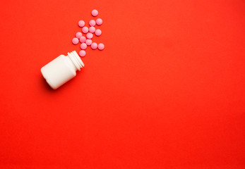 Spilled pills or tablets as pattern from a plastic drugs bottle