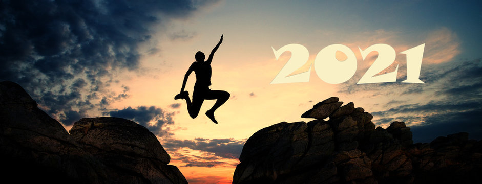 jumping between cliffs at sunset goals in new year