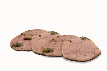 slices of beef topped with parsley