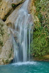 Waterfalls of the Guadalquivir river as it passes through the Utrero enclosure in the Sierra de Cazorla, Segura and Las Villas Natural Park. Jaen. Andalusia. Spain