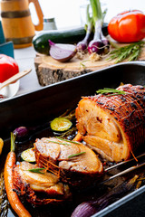 Lecere roll roast with vegetables and herbs.