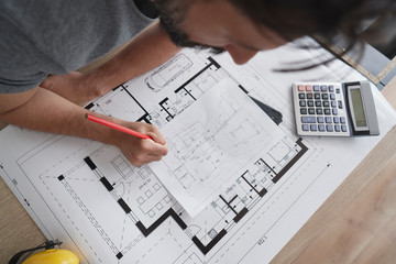 Top view architect correcting the designs
