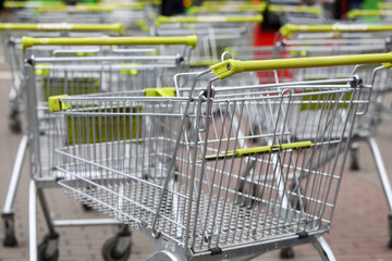 Shopping carts in supermarket are standing street