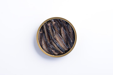 Smoked sprats in cooking oil in the open tin can isolated on white background - top view