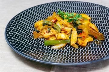 wok fried chicken stir fry with sweet peppers and chinese vegetables