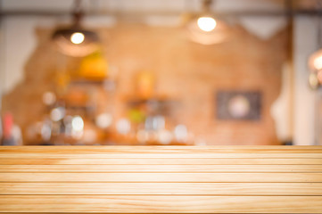 Brown Wooden table on coffee shop or restaurant background .