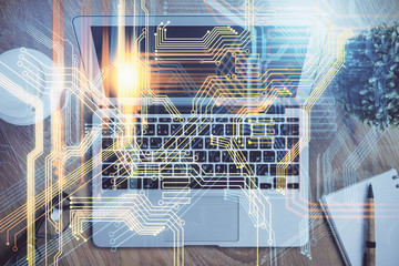 Multi exposure of table with computer and world map hologram. International data network concept.