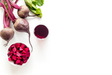 Beet - slices, fresh juice, green tops - from above copy space