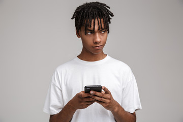 Portrait of smiling african man using mobile phone