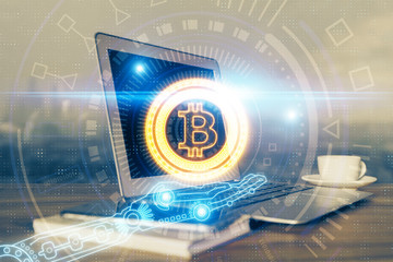 Multi exposure of blockchain theme hologram and table with computer background. Concept of bitcoin...