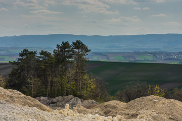 lime quarry with trees in a landscape