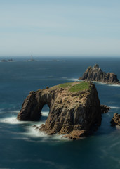 Fototapeta na wymiar Land's end cornwall Lighthouse seascape / landscape