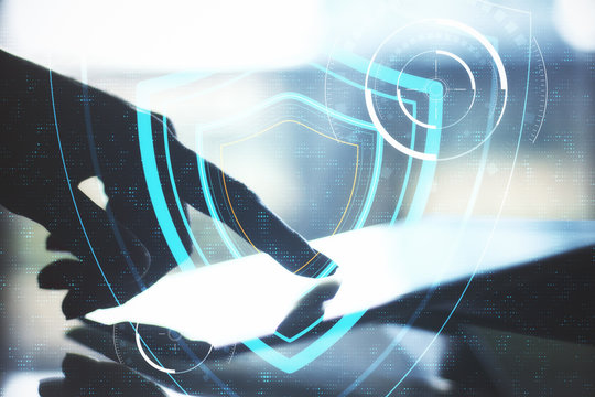 Hand using tablet on table and digital system security interface