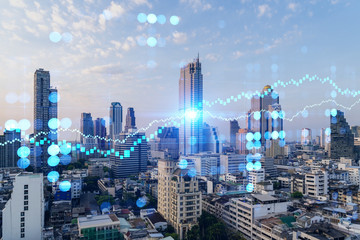 Obraz premium Sunset cityscape of Bangkok city view background with forex graph. Success and finance concept. Multiexposure