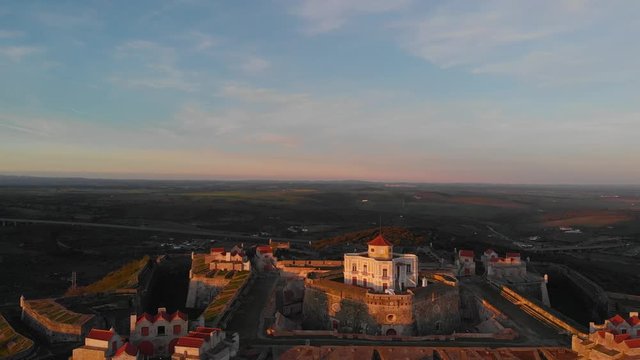 Lowering in the golden light for an aerial view of Fort of Nossa Senhora da Graca.