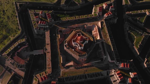 Tilting over the center structure of the Fort of Nossa Senhora da Graca while catching golden light.
