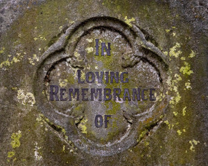 In Loving Remembrance of - written on a headstone in a graveyard.