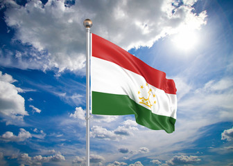 Realistic flag. 3D illustration. Colored waving flag of Tajikistan on sunny blue sky background.