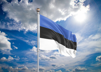 Realistic flag. 3D illustration. Colored waving flag of Estonia on sunny blue sky background.