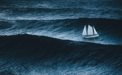 sailboat on the sea with storm and big waves © mimadeo