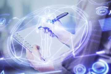 Education theme hologram over woman's hands writing background. Concept of study. Double exposure