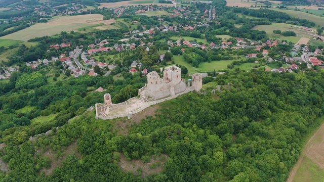 Csesznek, Hungary - 4K drone flying around of the ruins of the Castle of Csesznek lies in the Bakony in the village of Csesznek on a summer afternoon