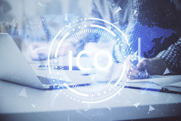 Blockchain theme hologram with man working on computer on background. Concept of crypto chain....