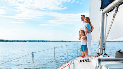 Family Standing On Yacht Deck Sailing Across The Sea, Panorama - obrazy, fototapety, plakaty