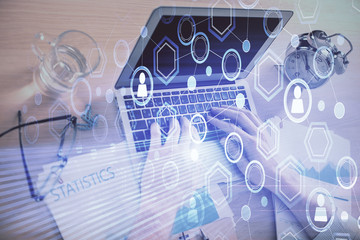 Social network theme hologram with businessman working on computer on background. Concept of world wide web. Double exposure.